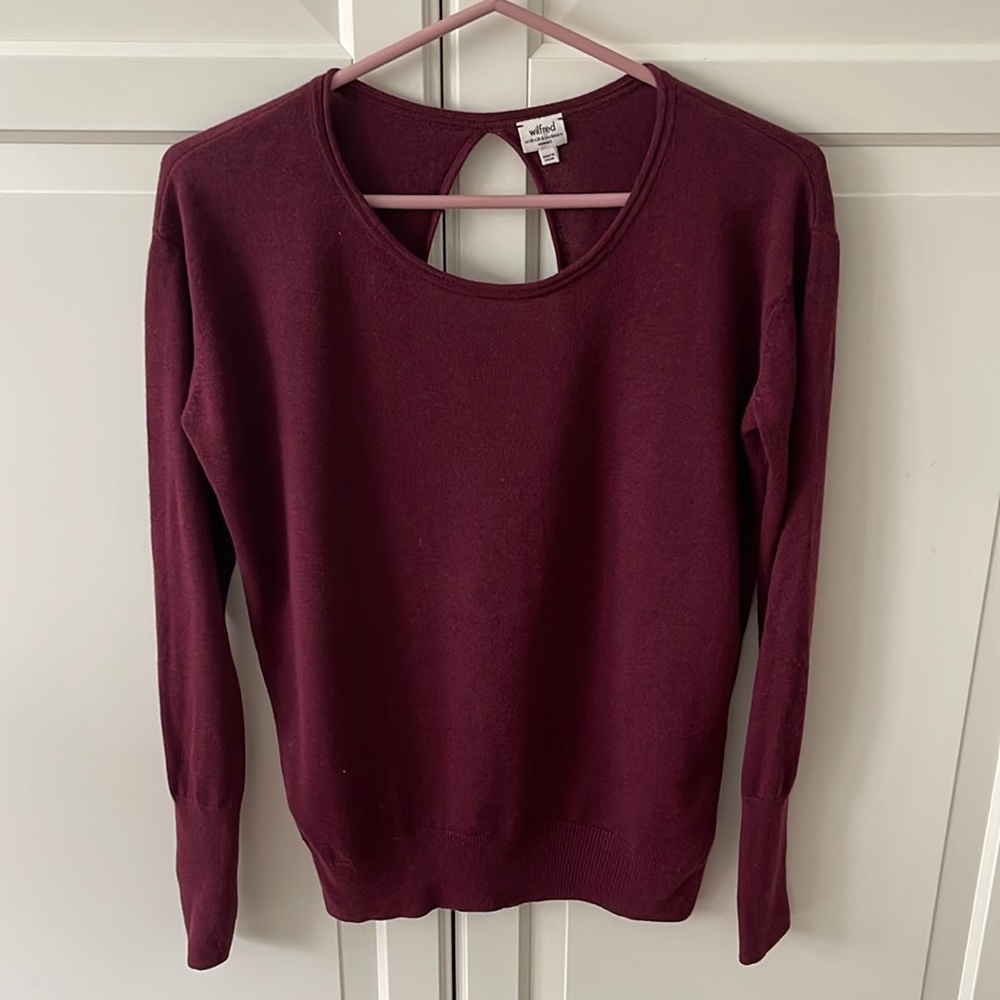 Wilfred sweater with open back.